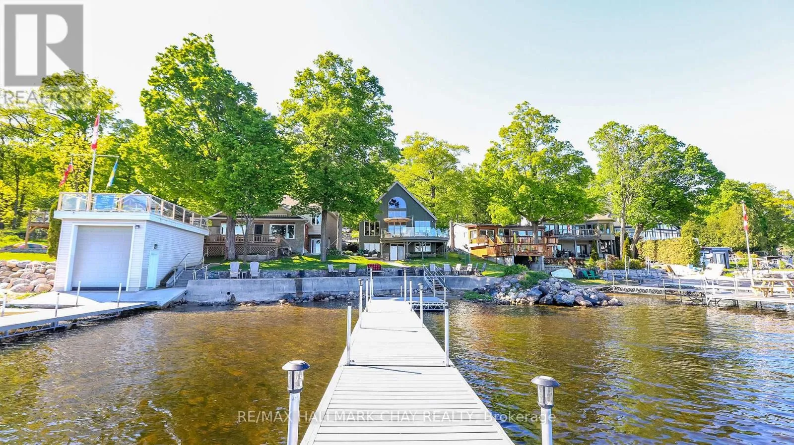 Private dock extending into Georgian Bay toward the home